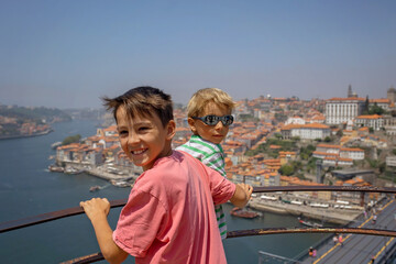 Fototapeta na wymiar Happy family, visiting Lisbon during summer holiday, people with children, enjoying cityscape
