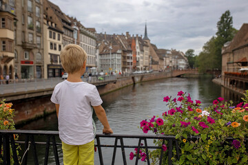 Beautiful family with children, boys, visiting Strasbourg during summer vacation