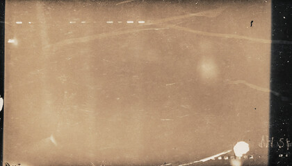 Dusty scratched and scanned old film texture with a vintage grunge overlay