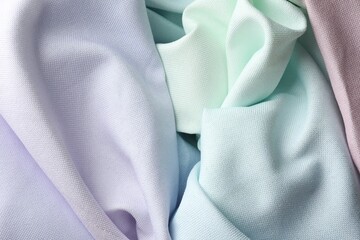 Different crumpled fabrics as background, top view