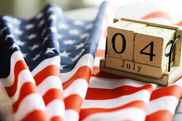 July 4th wooden Stars and Stripes flag on background with flag of the USA. Summer day. Independence...