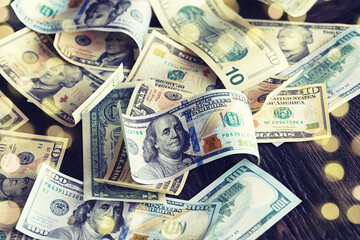 Money scattered on the desk. Money, US dollar bills background. Photography for Finance and Economy...