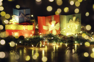 Obraz premium Christmas and New Year wooden background with light. Border art design with Christmas tree