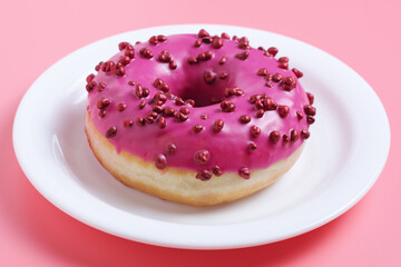 Pink donut in plate