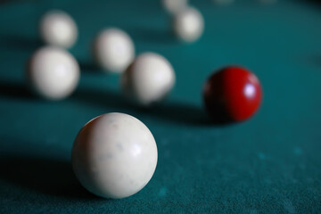 Russian billiard balls, cue, triangle, chalk on a table Green cloth Copy space
