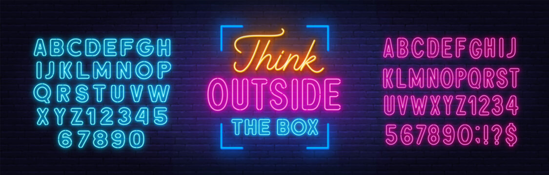 Naklejki Think outside the box - neon lettering on brick wall background