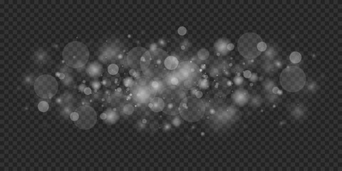 Sparkling magical dust particles. The sparkles sparkle with a special lighting effect. On a transparent background.