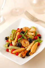 Salad with seafood, veggies and fruit.