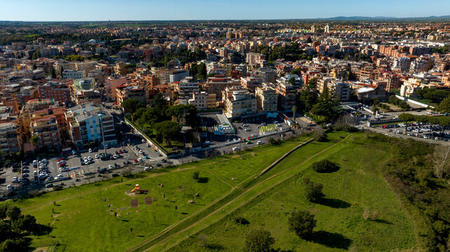 Aerial view on the houses and buildings of Primavalle district in Rome, Italy. In foreground there is Pineto Park.