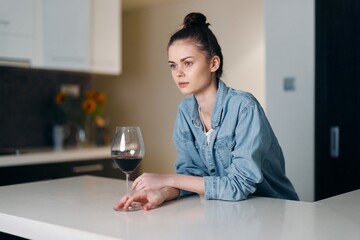 Lonely, Sad Woman Drinking Wine Alone: Portrait of a Desperate Lady in White Kitchen.