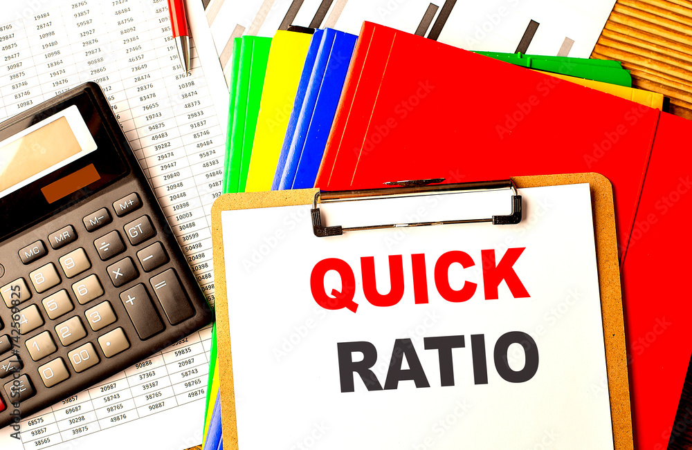 Poster quick ratio text written on paper clipboard with chart and calculator