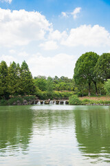 Fototapeta na wymiar Summer Green Trees and Water in Pearl Spring Scenic Area, Nanjing City, Jiangsu Province, China