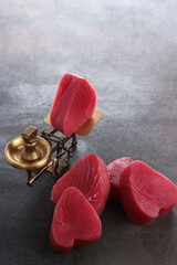 Fresh tuna. There are fresh pieces of tuna on the scales. Natural omega. Healthy dietary nutrition.