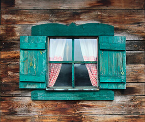 Open window wooden old style with green shutters on a wooden wall.