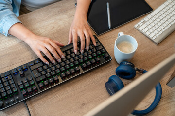 The image above shows a woman who is actively engaged in video editing work