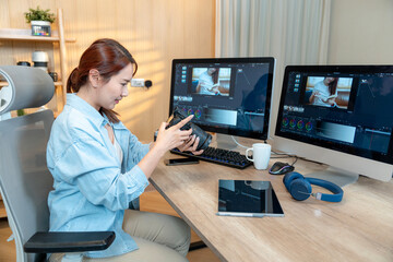 Young woman woking video editor in studio