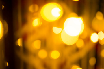 close-up blurred photo Golden decorative lights create a luxurious atmosphere at night events....