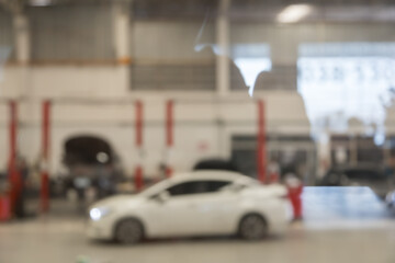 blured image of car service centre auto repair workshop