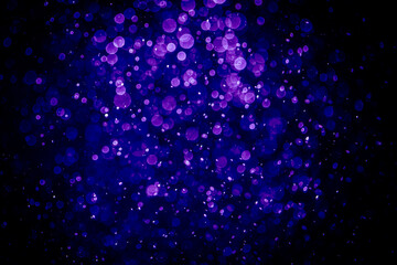Blurred photo with purple violet and blue dots visible glittering, shining brightly look and feel luxurious