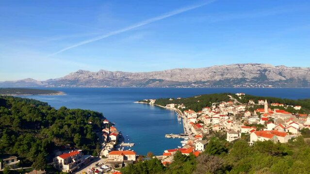 Coastal village on the Adriatic coast. Ocean and mountain views over looking the beautiful town of Povlja, Brac Island, Croatia. Europe.