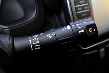 Car windshield wiper switch. Wipers switch control. Adjusting speed wipers in car. Wiper switch toggle. Automotive part concept. - obrazy, fototapety, plakaty