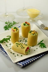 Paccheri pasta with salad.