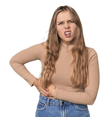 Studio portrait of a blonde Caucasian woman having a liver pain, stomach ache.