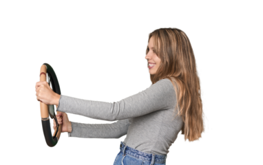 Caucasian blonde with steering wheel, playfully mimicking driving .