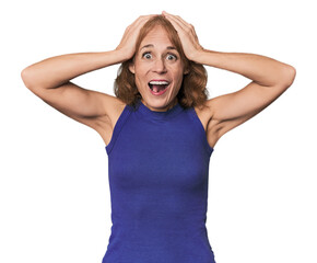Redhead mid-aged Caucasian woman in studio screaming, very excited, passionate, satisfied with...