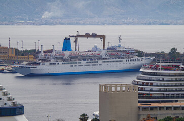 Classic cruiseship cruise ship liner Celebration docked at pier in Messina Sicily port, Italy...