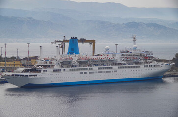 Classic cruiseship cruise ship liner Celebration docked at pier in Messina Sicily port, Italy...