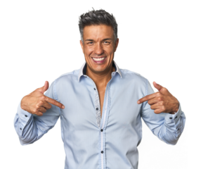 Middle-aged Latino man surprised pointing with finger, smiling broadly.