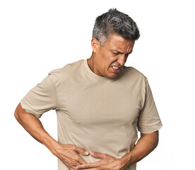 Middle-aged Latino man having a liver pain, stomach ache.