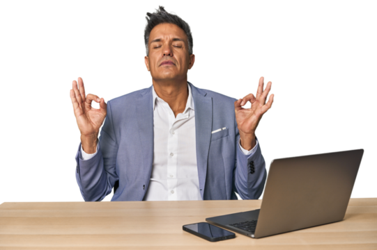 Elegant businessman at desk with laptop relaxes after hard working day, she is performing yoga. - Powered by Adobe