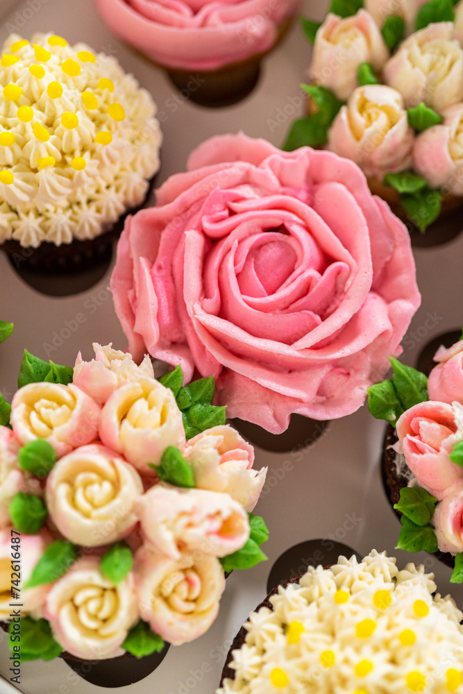 Wall mural delicious gourmet cupcakes topped with buttercream frosting flowers