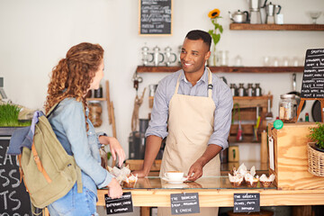 Barista, cafe and customer service with order, drink and talking with smile for support or...
