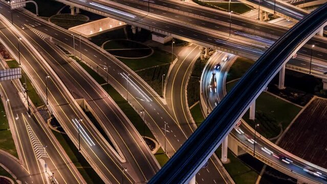 Aerial View of Overpass, Metro and City Traffic at Night _ Dubai, UAE