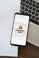 Emergency alert notification appearing on the phone while in use. - obrazy, fototapety, plakaty