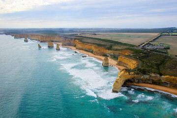 Fototapeta premium Aerial view of the Australian coastline at the Twelve Apostles in the Port Campbell National Park - Collection of limestone stacks in the Tasman Sea off the coast of Victoria, Australia