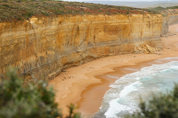 Cliffs towering above Gibson Beach at the Twelve Apostles Marine National Park along the Great Ocean Road in Victoria, Australia