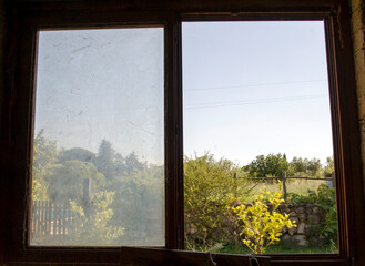 Old Window overlooking the field. Countryside.