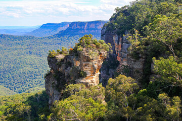 Orphan Rock, a rocky outcrop protruding over the rainforest of the Jamison Valley in Scenic World,...