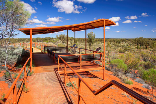 Elevated Kata Tjuta dunes viewing platform near Mount Olga, a large domed rock formation in Northern Territory, Central Australia, surrounded by bushland and steppes