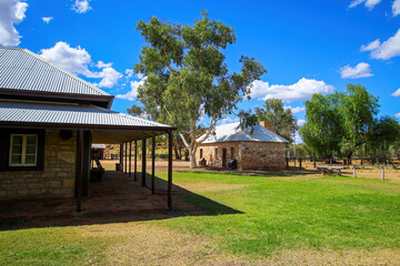 Fototapeta na wymiar Old buildings of the Alice Springs Telegraph Station Historical Reserve in the Red Centre of Australia, connecting Darwin to Adelaide via the Overland Telegraph Line