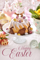 Easter greeting card with traditional ring cake on festive table
