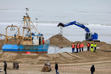 Rescue operations of a stranded fishing ship, Zandvoort, The Netherlands - obrazy, fototapety, plakaty