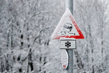 warning sign danger of skidding, snow covered in winter, Munich, Bavaria, Germany © Andreas