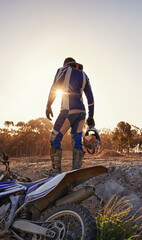 Motorcycle, sports and danger with back view of biker person outdoor, sunlight with uniform for...
