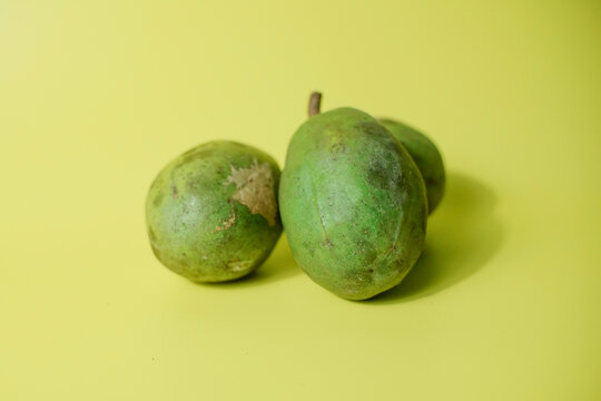 Kedondong or ambarella fruit or otaheite apple or great hot plum fruit on yellow background, tropical fruit