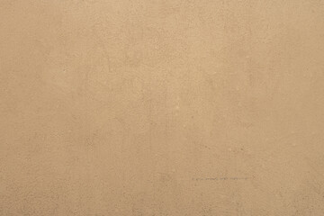 Fototapeta na wymiar abstract background of beige embossed plastered wall painted light ocher close up
